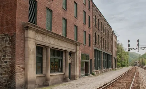 Sidewalks and railways run among abandoned buildings in thurmond wv